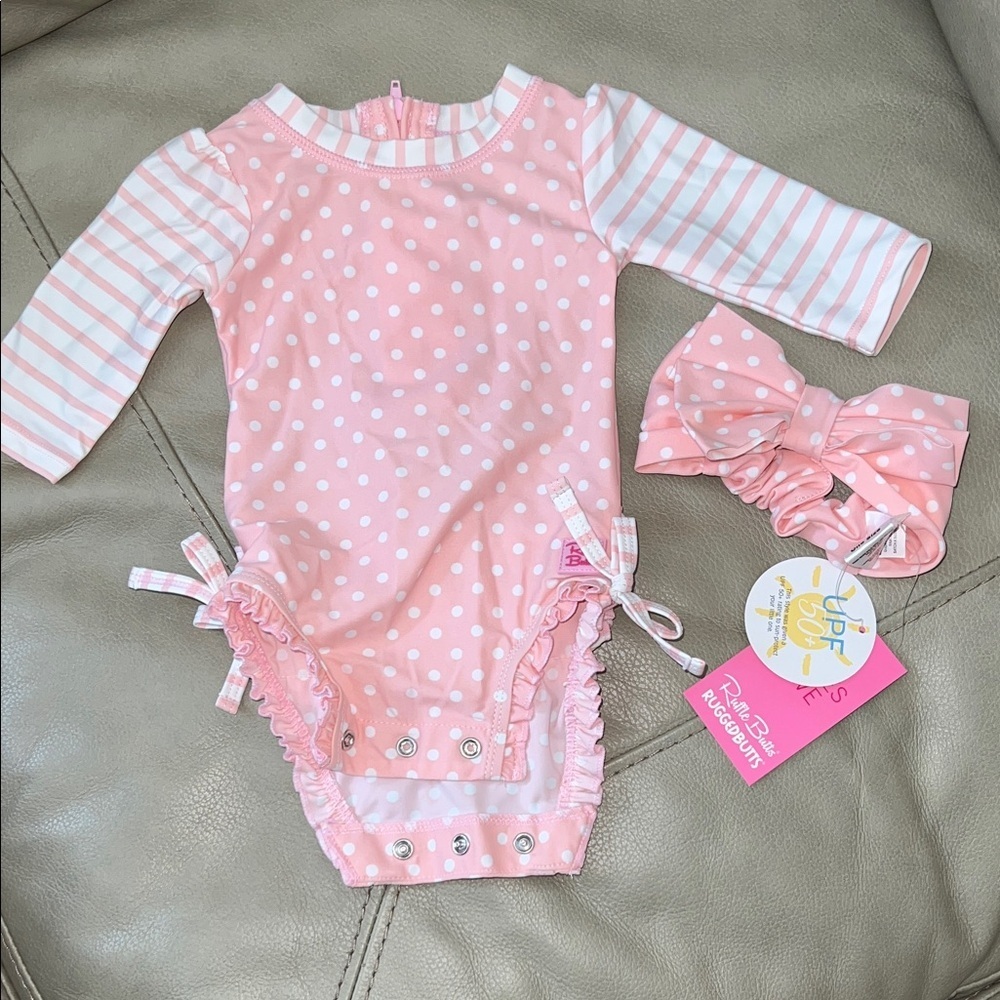 NWOT Ruffle Butts Pink and White Polka Dot Rashguard with Bow 0-3 months